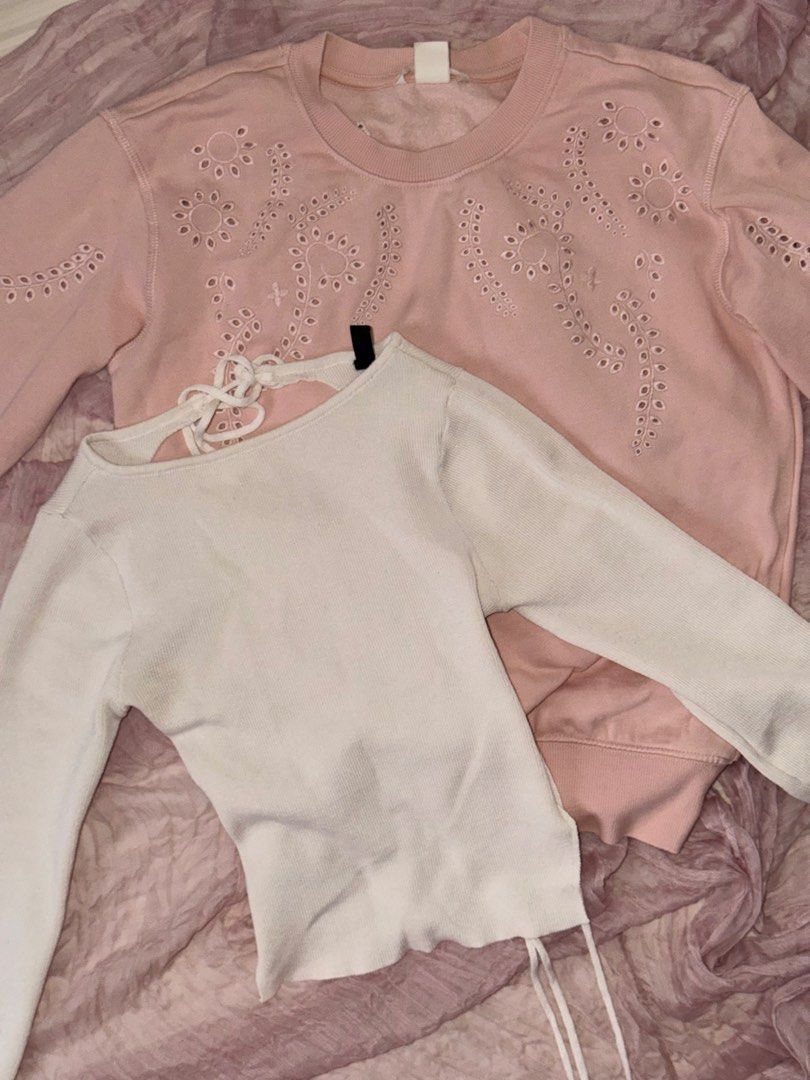 [BUNDLE] H&M Pink Sweatshirt & Divided Backless White Knit Longsleeve Top (Category: Others Tops) located in Bacolod City. Submitted by starqarts (Listing ID 1457598853, Image 1). Description: Bundle of two tops from H&M. Includes a pink sweatshirt with eyelet details and a white ribbed knit long-sleeve backless top from Divided. Both are size XS! Great for casual wear :) RFS: Need funds for thesis :”) ! NOTE: Free SF if total adds up to ₱699+!.