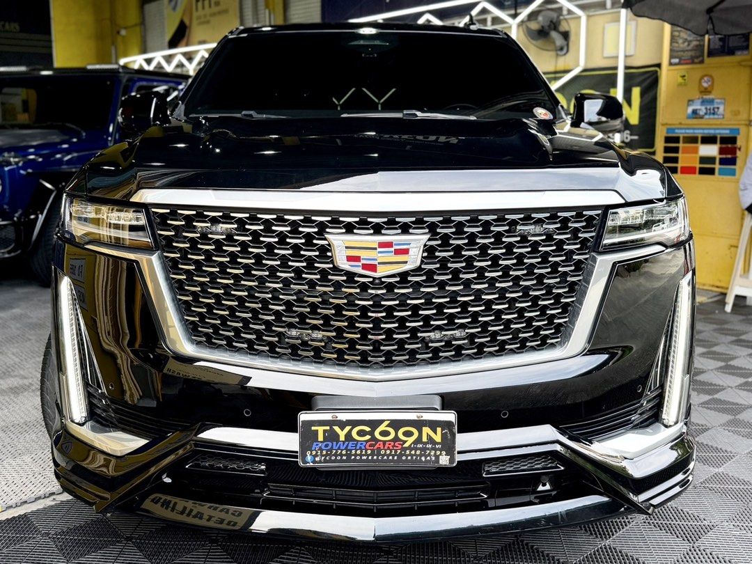 Cadillac Escalade Premium Auto (Category: Used Cars) located in Pasig City. Submitted by tycoon.cars (Listing ID 1457565801, Image 2). Description: CADILLAC ESCALADE PREMIUM - 2021 Model - 16,XXX kms. Original Mileage - 6.2L V8 Gasoline Engine - 10-Speed Automatic Transmission - Zero Design Body Kit - Full Paint Protection Film Installed - 26s Mags Custom Forged - SUPER FRESH We Don’t Sell Cars, We Sell Dreams. BUY•SELL•TRADE•CONSIGN•FINANCING Ty