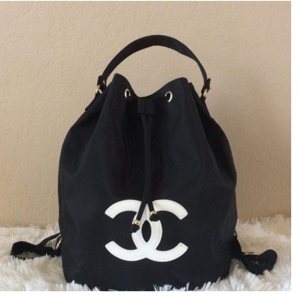 CC VIP Drawstring Bag (Category: Luxury Bags & Wallets) located in Makati City. Submitted by yerbua103 (Listing ID 1457684038, Image 1). Description: This is a black Chanel VIP drawstring bag/mini backpack featuring a prominent CC logo patch. It has a gold-tone hardware and a black nylon drawstring closure. First 2 pics are for reference only. Manage your expectations as you're buying a preloved/ukay bag. .