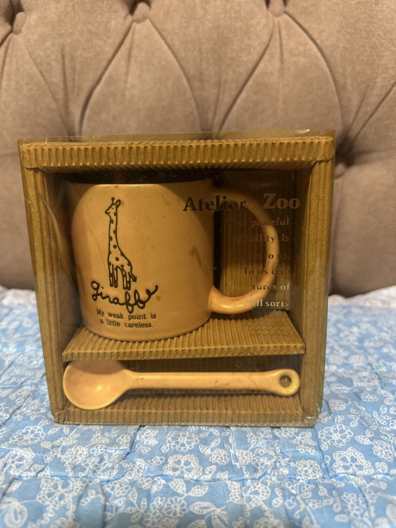 ceramic coffee mug set with spoon (Category: Coffee & Tea Tableware) located in Davao. Submitted by favoritepreloved (Listing ID 1457648965, Image 3). Description: 💜 features a cute giraffe illustration with the text "My weak point is a little careless" and includes a matching spoon in a presentation box..