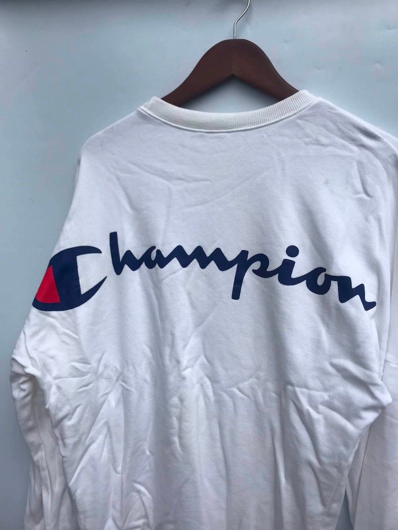 Champion White Long Sleeve Sweatshirt Size M (Category: Coats, Jackets and Outerwear) located in Manila. Submitted by deguertoje73072 (Listing ID 1457552345, Image 3). Description: - Authentic Champion sweatshirt - Size: Medium (M) - Classic Champion logo prominently displayed on the back - Small Champion logo on the chest - Additional small logo detail on the sleeve cuff - Genuine American Athletic Apparel.