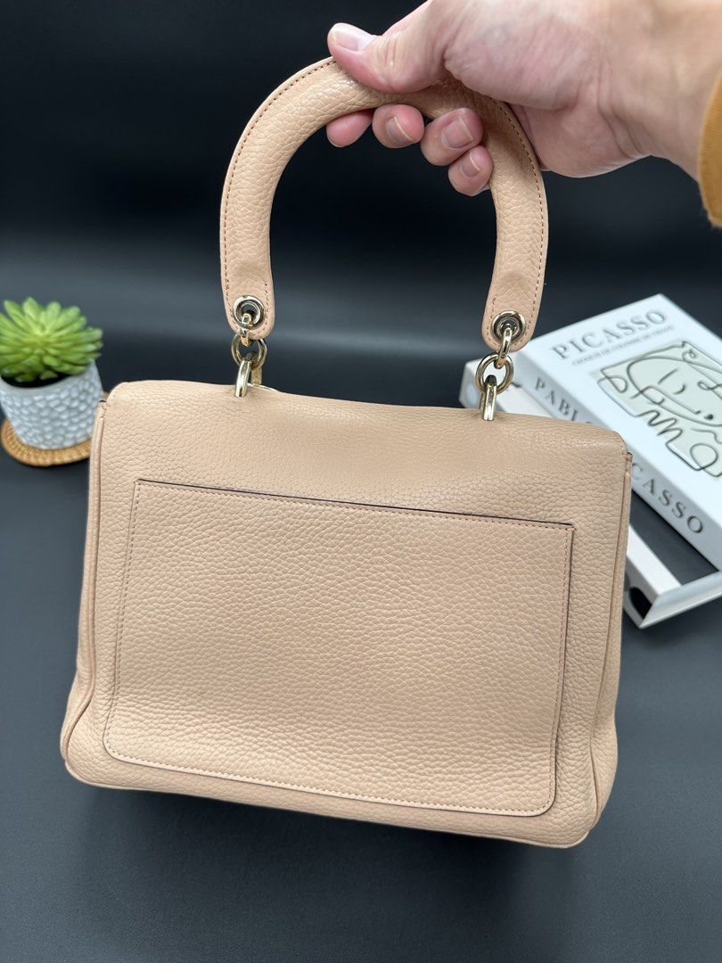 Christian Dior Be Dior Flap Bag (Category: Luxury Bags & Wallets) located in Baguio. Submitted by .daryl (Listing ID 1457607988, Image 2). Description: 8 inches height 10 inches width 5 inches base Missing: I, O, R charm Missing: Sling.