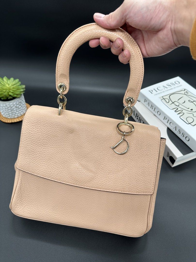 Christian Dior Be Dior Flap Bag (Category: Luxury Bags & Wallets) located in Baguio. Submitted by .daryl (Listing ID 1457607988, Image 1). Description: 8 inches height 10 inches width 5 inches base Missing: I, O, R charm Missing: Sling.