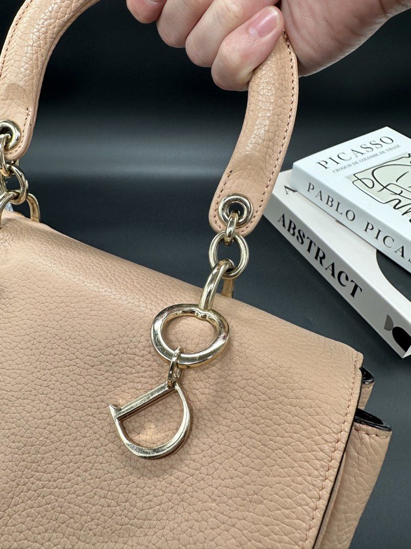 Christian Dior Be Dior Flap Bag (Category: Luxury Bags & Wallets) located in Baguio. Submitted by .daryl (Listing ID 1457607988, Image 3). Description: 8 inches height 10 inches width 5 inches base Missing: I, O, R charm Missing: Sling.