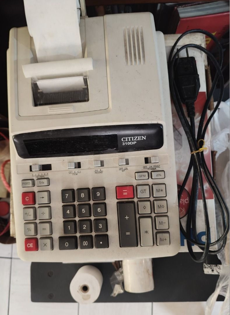 DISCOUNTED = CITIZEN 310DP Vintage/Legacy Printing Adding Machine (Category: Office & Business Technology) located in Quezon City. Submitted by oddduck02 (Listing ID 1457576735, Image 2). Description: - CITIZEN 310DP Printing adding machine with adding machine paper tapes attached. - With extra 5pcs adding machine paper tapes included - Made in Thailand - 220V - Reason for selling - Cleaning house - Needs paper ink change since numbers are not as
