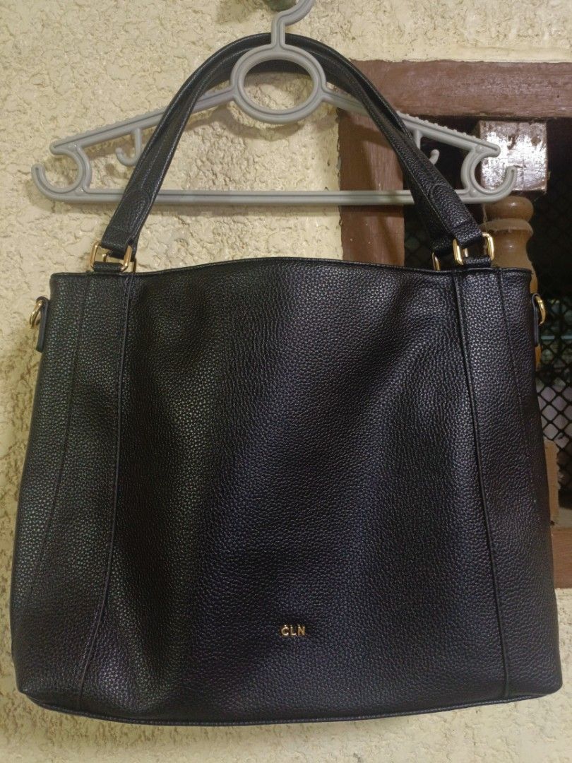 CLN Leira shoulder bag (Category: Shoulder Bags) located in Santa Cruz. Submitted by beabagos (Listing ID 1457614496, Image 2). Description: - Brand: CLN - Material: Black pebbled leather - Style: Tote bag - Features: Top handles, adjustable shoulder strap - Compartments: Zip main compartment with interior slip pockets, back exterior zip pocket - Hardware: Gold-tone - Design: Simple and classic.
