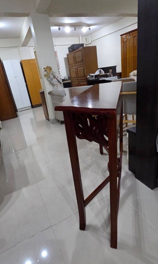 Console table (Category: TV Consoles) located in Quezon City. Submitted by jmandchad143 (Listing ID 1457517857, Image 2). Description: For sale! Console wood table OR Hallway table featuring an ornate, open-carved apron and a crossed stretcher base. Solid wood Malinis Quality japan surplus Guaranteed item is in good condition and clean.