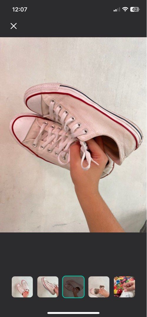 Converse All Star Chuck Taylor White Canvas Shoes (Category: Sneakers) located in Caloocan City. Submitted by heyitsvenice (Listing ID 1457544694, Image 3). Description: - Classic white low-top Converse Chuck Taylors - Iconic red and blue stripe accents - Durable canvas material - White laces - Minor signs of wear on soles and toe cap - Plenty of life left, great for everyday wear.
