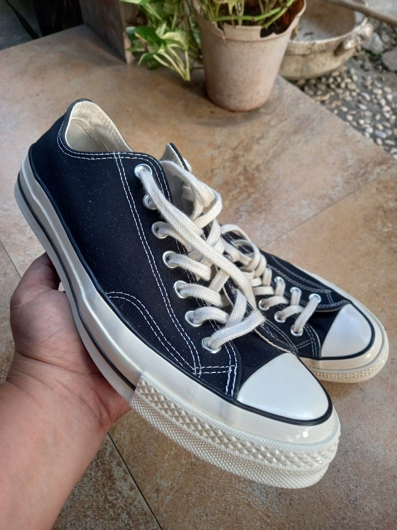 Converse Chuck Taylor All Star 70s Low Top Black (Category: Sneakers) located in Davao. Submitted by kirk214red-50020 (Listing ID 1457708245, Image 1). Description: - Classic black Converse Chuck Taylor All Star 70s low tops - Features white laces and white toe cap - Cream sole for a vintage look - Ideal for everyday wear - A versatile staple that pairs easily with any outfit.