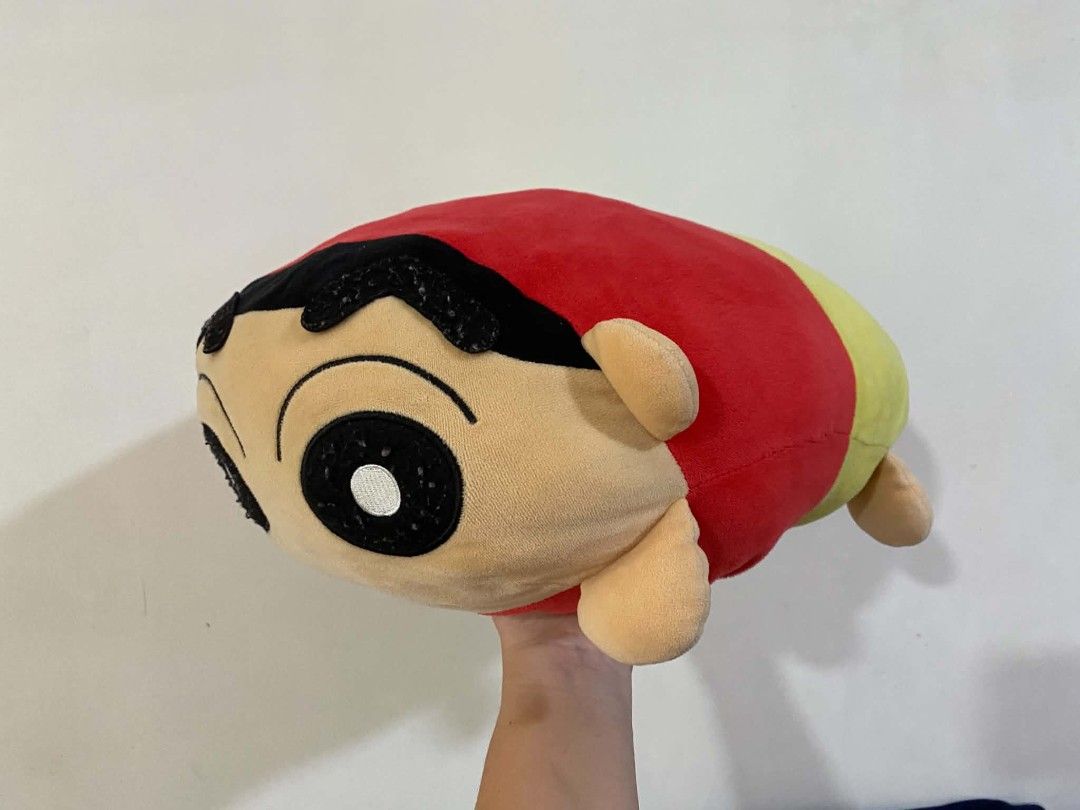 Crayon Shin-chan Plush Toy Pillow (Category: Plushies & Soft Toys) located in Quezon City. Submitted by marcplusclein (Listing ID 1457575580, Image 3). Description: - Adorable Crayon Shin-chan plush toy - Round and squishy design, perfect for hugging or using as a pillow - Features Shin-chan's signature surprised expression - Made from soft and cuddly material - Ideal for Shin-chan fans and as a fun room decoration.