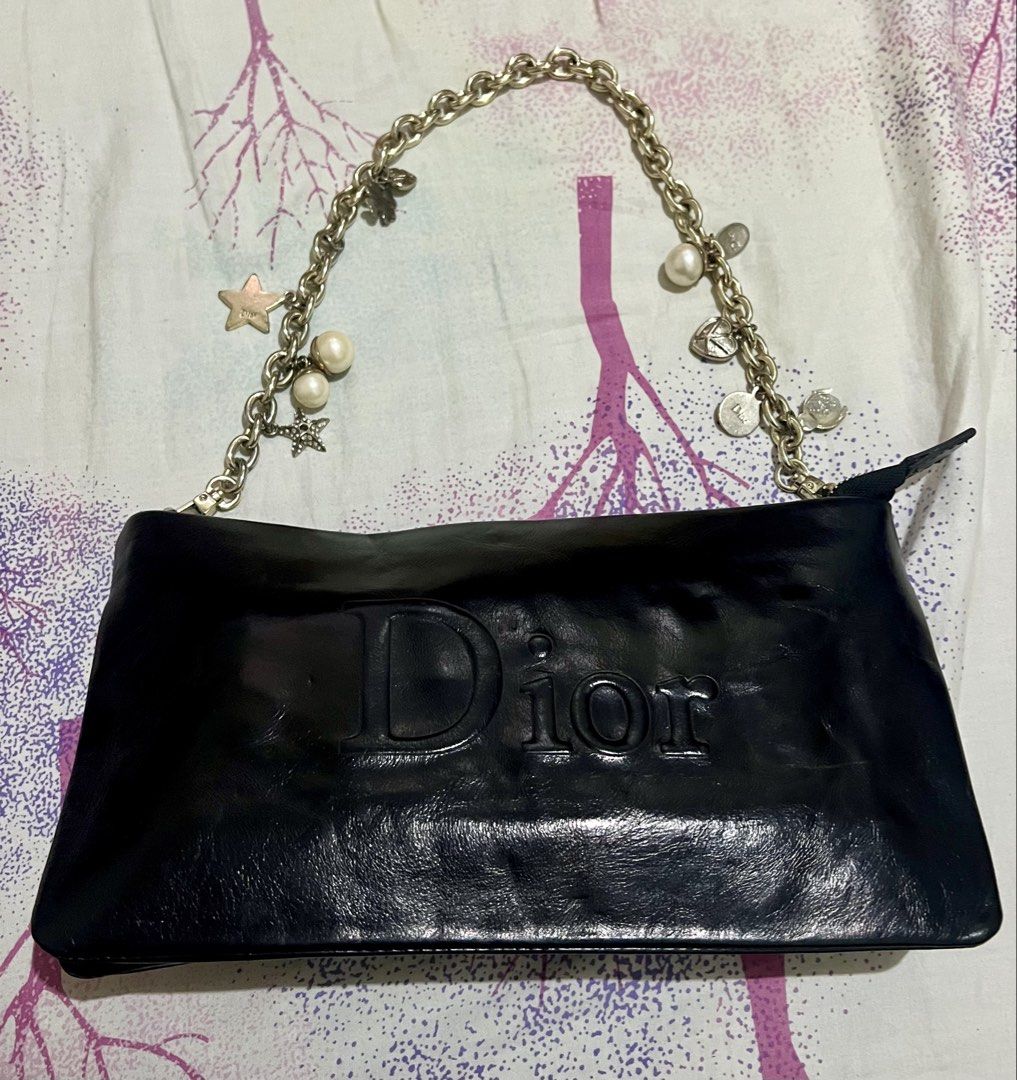 Dior Black Leather Shoulder Bag with Charms (Category: Luxury Bags & Wallets) located in Dagupan City. Submitted by casadebayongph (Listing ID 1457648311, Image 2). Description: - Black Dior Shoulder Bag - Genuine Leather with Embossed Dior Logo - Secure Zipper Closure - Dior Branded Interior Lining - Silver-Tone Chain Strap with Star and Pearl Charms - Ideal for Casual Outings and Everyday Style.