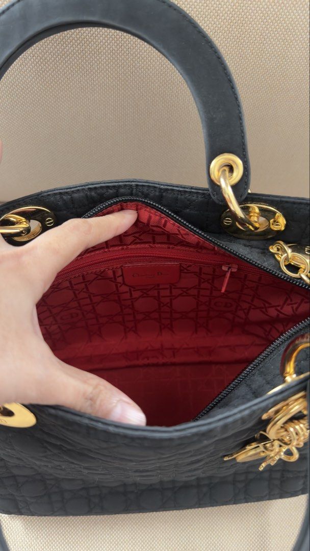 Dior Lady Dior Black Nylon Medium (Category: Luxury Bags & Wallets) located in Caloocan City. Submitted by Sweetie (Listing ID 1457585555, Image 3). Description: - Authentic Dior Lady Dior Bag - Color: Black - Material: Nylon with signature cannage stitching - Hardware: Gold tone - Interior: Red lining with one zip pocket - Features: Top handles, structured base - Includes: Original dust bag.