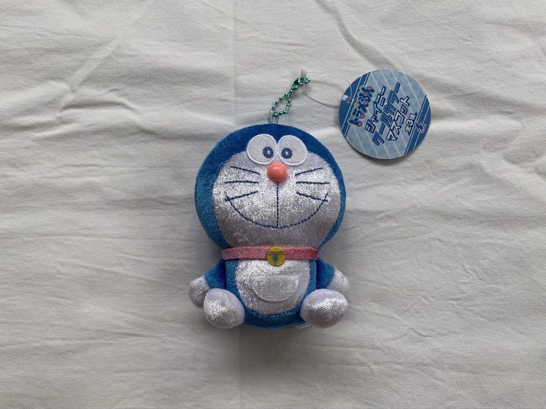 Doraemon Plush Toy Keychain with Tag (Category: Plushies & Soft Toys) located in Tumauini. Submitted by bihisbyme (Listing ID 1457624976, Image 1). Description: - Adorable Doraemon plush toy - Features a convenient keychain attachment - Approximately 5 inches in height - Made from soft and cuddly material - Ideal for Doraemon enthusiasts or as a stylish bag charm - Comes with the original tag still attached.