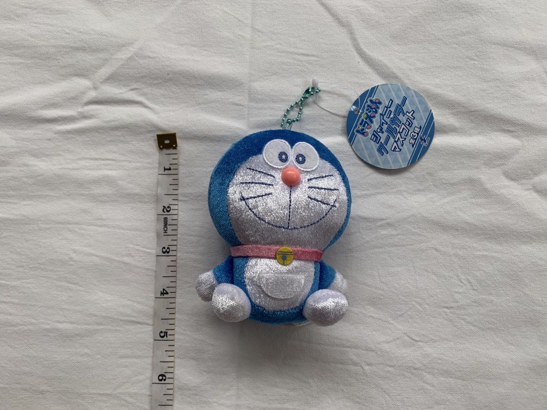 Doraemon Plush Toy Keychain with Tag (Category: Plushies & Soft Toys) located in Tumauini. Submitted by bihisbyme (Listing ID 1457624976, Image 2). Description: - Adorable Doraemon plush toy - Features a convenient keychain attachment - Approximately 5 inches in height - Made from soft and cuddly material - Ideal for Doraemon enthusiasts or as a stylish bag charm - Comes with the original tag still attached.