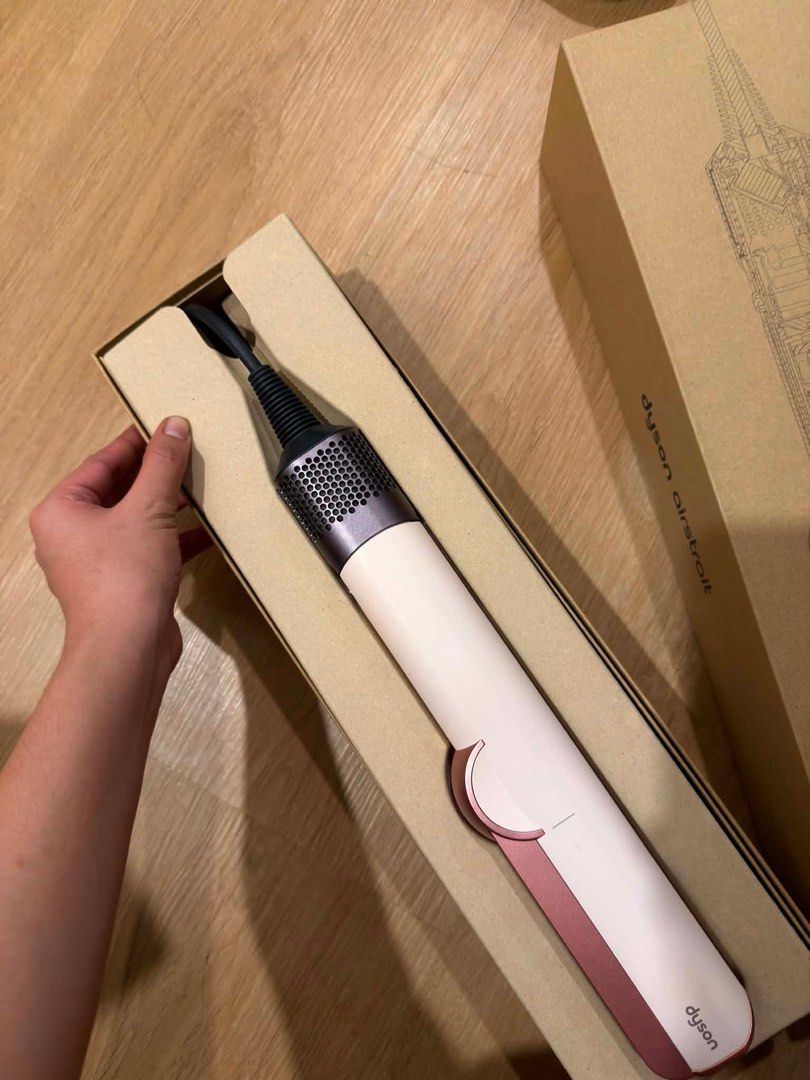 Dyson Airstrait Straightener - White/Pink (Category: Hair) located in Rizal. Submitted by Izyokim (Listing ID 1457631955, Image 1). Description: PLEASE READ!! * Selling: Dyson Airstrait - Ceramic Pink Pre-loved but still in good condition! SECOND HAND po No damage and well taken care of. Used, but not abused. Original Price (Bought): P34,900 Selling Price: P22,500 RFS: No longer needed. Issue: Minor Stains Message me for inquiries or photos. Seri