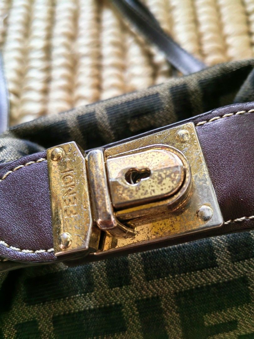 Fendi Zucca Canvas Mini Baguette Bag (Category: Luxury Bags & Wallets) located in Davao. Submitted by gelleevanelli (Listing ID 1457547754, Image 2). Description: *Vintage Fendi Zucca Canvas Mini Doctor Boxy Bag* *Condition:* Vintage / Pre-loved - *Exterior*: Zucca FF jacquard canvas in brown/tobacco. Pattern is aligned and weave is tight. - *Leather*: Dark brown leather trim + strap with white contrast stitching. _Note: peeling/wear on leather n