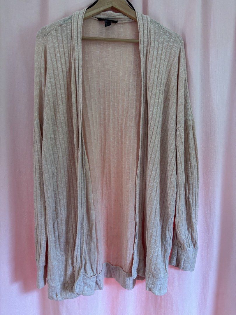 Forever 21 Lightweight Ribbed Open Cardigan (Category: Coats, Jackets and Outerwear) located in Pasuquin. Submitted by gabelli.declutters (Listing ID 1457555892, Image 2). Description: Condition: 9/10 (Excellent preloved condition, no tears) Product Details: Brand: Forever 21Size: Small (S) on tag (Fits true to size, slightly relaxed fit) Color: Light Beige / Cream / Oatmeal Material: Lightweight ribbed knit fabric (very soft and breathable, perf