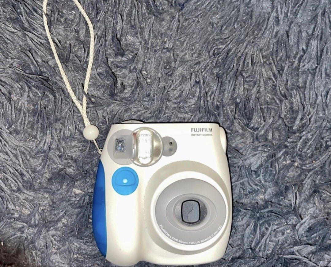 Fujifilm Instax Mini 7S Instant Camera White Blue (Category: Cameras) located in Rosario. Submitted by Cess1 (Listing ID 1457621168, Image 1). Description: - Fujifilm Instax Mini 7S instant camera - Available in White and Blue - Features built-in flash and lens - Simple and easy to use for quick photos - Ideal for capturing memories at parties and events - Comes with a convenient wrist strap.
