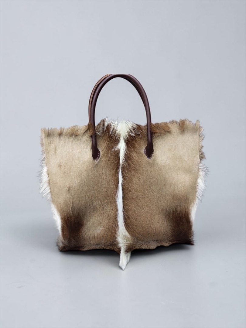Fur Bag Antelope Leather Cowhide Handle (Category: Luxury Bags & Wallets) located in Manila. Submitted by designerarchives.ph (Listing ID 1457698298, Image 2). Description: Lining Material: Sheepskin Texture: Mink Hair Closure: Magnetic Buckle Comes with FREE WALLET. Same material Tote Bag — ₱18 500 Envelope Bag - ₱16 500 How to order? • 50% DP is required • 2 weeks eta • Buyer will shoulder the sf.
