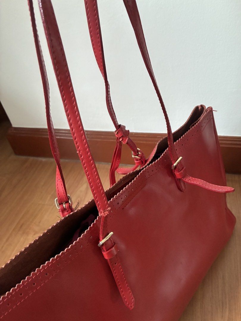 Furla red leather tote bag (Category: Shoulder Bags) located in Manila. Submitted by snappyaura (Listing ID 1457520674, Image 3). Description: - Stylish brown tote bag - Durable canvas material - Spacious interior - Classic and versatile design Note: have to fix the strap .