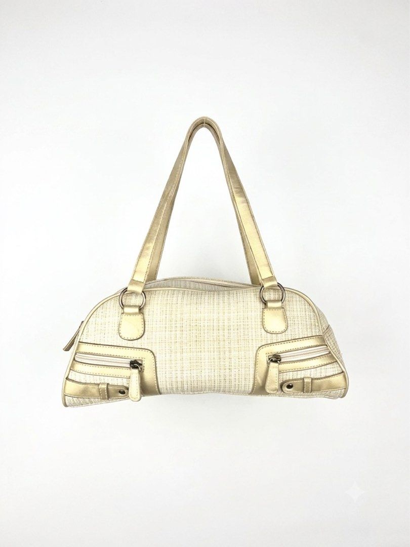 Glam Metallic Trim Bowler Bag (Category: Shoulder Bags) located in Angeles City. Submitted by fruits.ph (Listing ID 1457536544, Image 1). Description: Measurements: W: 13” H: 5.5” D: 4.5” Handle Drop: 9” *Flat lay measurements* Brand: N/A Type: Shoulder Bag Material: Canvas Color: Cream/Metallic Gold Capacity: Fits phone, wallet, sunglasses, small pouch & keys. Condition: 9/10 Flaws: Minor Exterior Stain(Back Part) and Interior Lining Yellow Stai