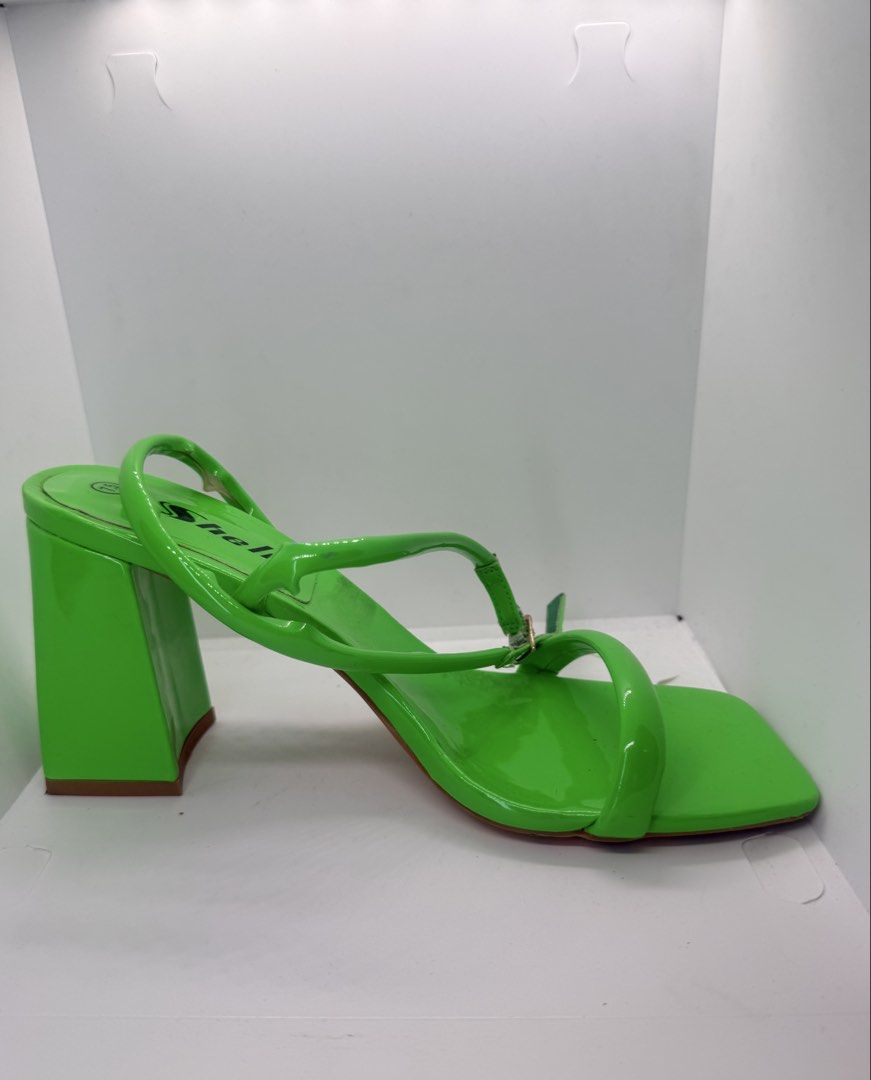Green block heel sandals 7.5 US (Category: Heels) located in Mandaluyong City. Submitted by cherryspicks (Listing ID 1457625861, Image 1). Description: Size US 7.5. Used once only. Bright neon green , comfortable height. Some parts of the strap have come loose, but one can easily stick them back together with super glue! .