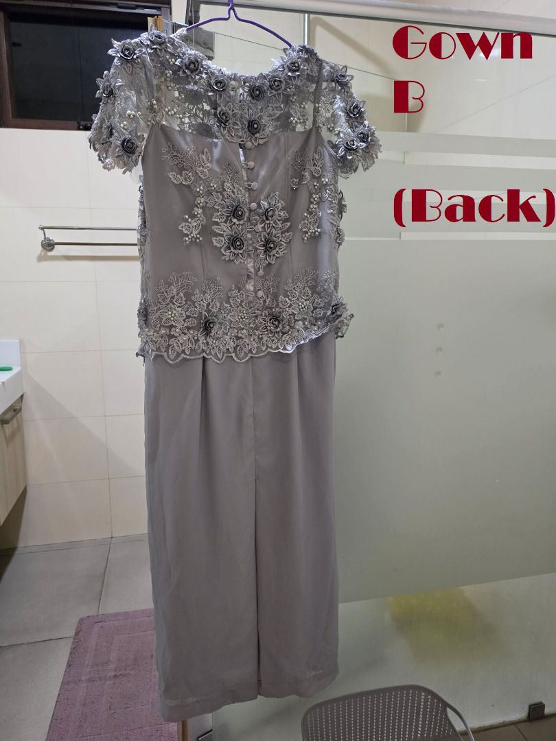 Grey Lace Embellished Gown with Back Slit (Category: Evening dresses & gowns) located in Manila. Submitted by gencomanila (Listing ID 1457586474, Image 3). Description: - Stunning grey gown perfect for formal events. - Intricate lace and bead embellishments on the bodice and sleeves. - Elegant draped detailing on the skirt. - Convenient slit at the back for ease of movement. - Secure button closure at the back. - Size: Large or XL.