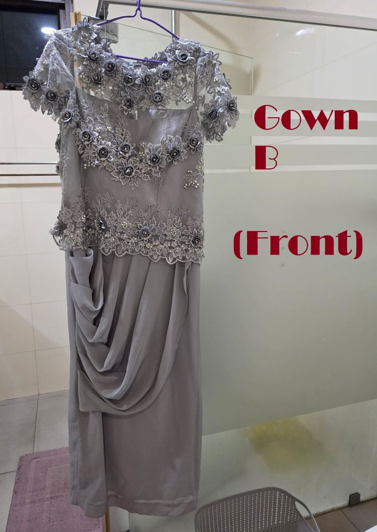 Grey Lace Embellished Gown with Back Slit (Category: Evening dresses & gowns) located in Manila. Submitted by gencomanila (Listing ID 1457586474, Image 2). Description: - Stunning grey gown perfect for formal events. - Intricate lace and bead embellishments on the bodice and sleeves. - Elegant draped detailing on the skirt. - Convenient slit at the back for ease of movement. - Secure button closure at the back. - Size: Large or XL.