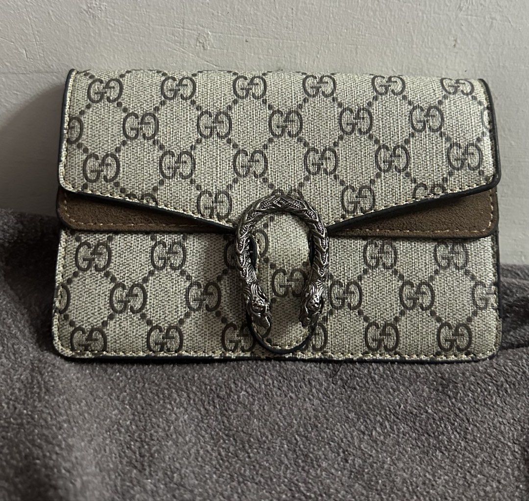 Gucci Dionysus Wallet with Chain (Category: Luxury Bags & Wallets) located in Tarlac. Submitted by wearagainboutique (Listing ID 1457591699, Image 1). Description: - PROJECT BAG - Beige and Brown GG Supreme Canvas - Signature Dionysus Tiger Head Spur - Leather Trim and Suede Detail - Detachable Chain Strap Included - Made in Italy -No Code -Flaws see last picture .