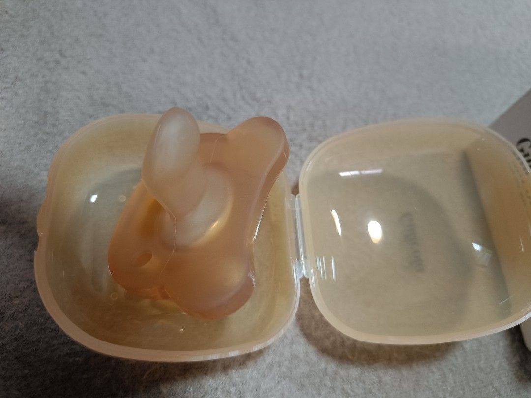 GuliGuli Baby Pacifier with Case (Category: Soothers & Pacifiers) located in Orani. Submitted by mbfb_btn (Listing ID 1457614002, Image 2). Description: - Set of two Gulicola baby pacifiers - Left (tried once) - Right (Brandnew) - Made from safe silicone - Includes individual clear travel cases for hygiene and portability - Ideal for soothing your baby - Easy to clean and store.