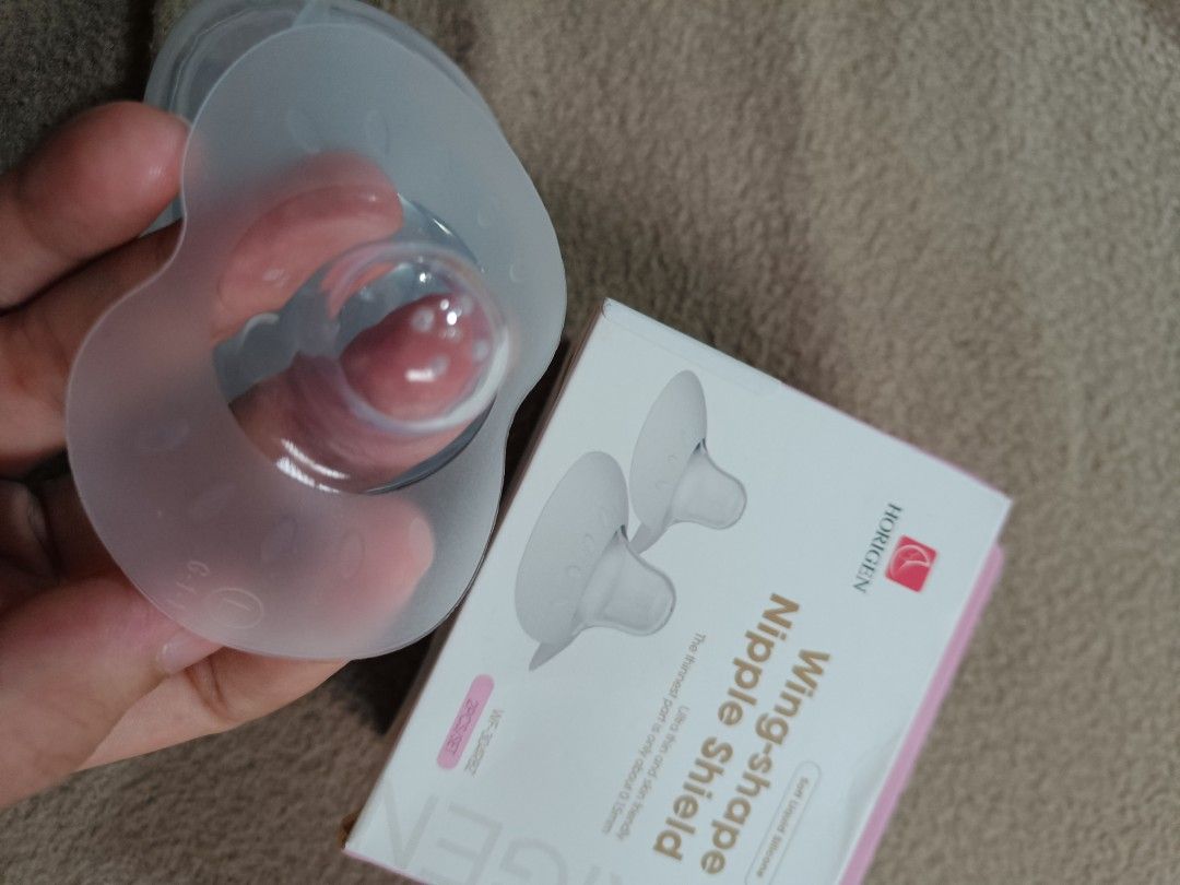 Horigen Wing-shape Nipple Shield Breastfeeding Aid (Category: Breastfeeding & Bottle Feeding) located in Orani. Submitted by mbfb_btn (Listing ID 1457614282, Image 1). Description: - Horigen Wing-Shape Nipple Shields - Made of soft silicone - SIZE LARGE (16-20mm) - Helps with breastfeeding comfort - Comes with a protective case - Easy to use and clean - Designed for moms.