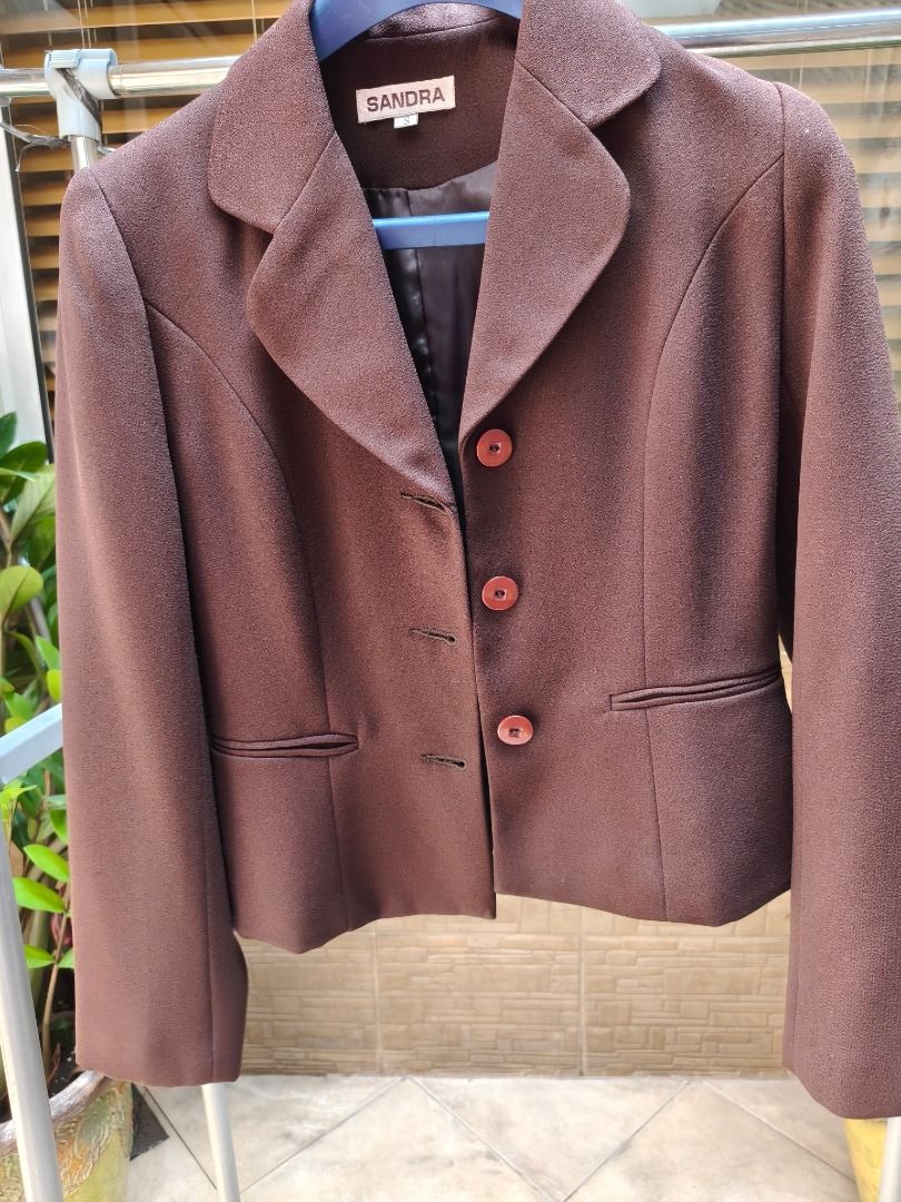 HOT SALE SANDRA Brown Button-Up Blazer (Category: Coats, Jackets and Outerwear) located in Manila. Submitted by olxph_674182959 (Listing ID 1457544442, Image 1). Description: - Classic brown blazer from SANDRA - Features a notched lapel - Three button closure - Two front pockets with flap details - Fully lined interior - Ideal for work or smart casual occasions - Sharp and professional look.