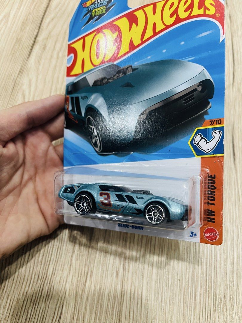 Hot Wheels Slide-Burn 2026 HW Torque (Category: Vehicle & Diecast Models) located in Quezon City. Submitted by ccgem (Listing ID 1457612760, Image 2). Description: - Brand: Hot Wheels - Model: HW Torque Slide-Burn - Color: Blue - Series: 7 out of 10 - Condition: Brand new, still in original packaging - Ideal for: Collectors, kids who love toy cars.