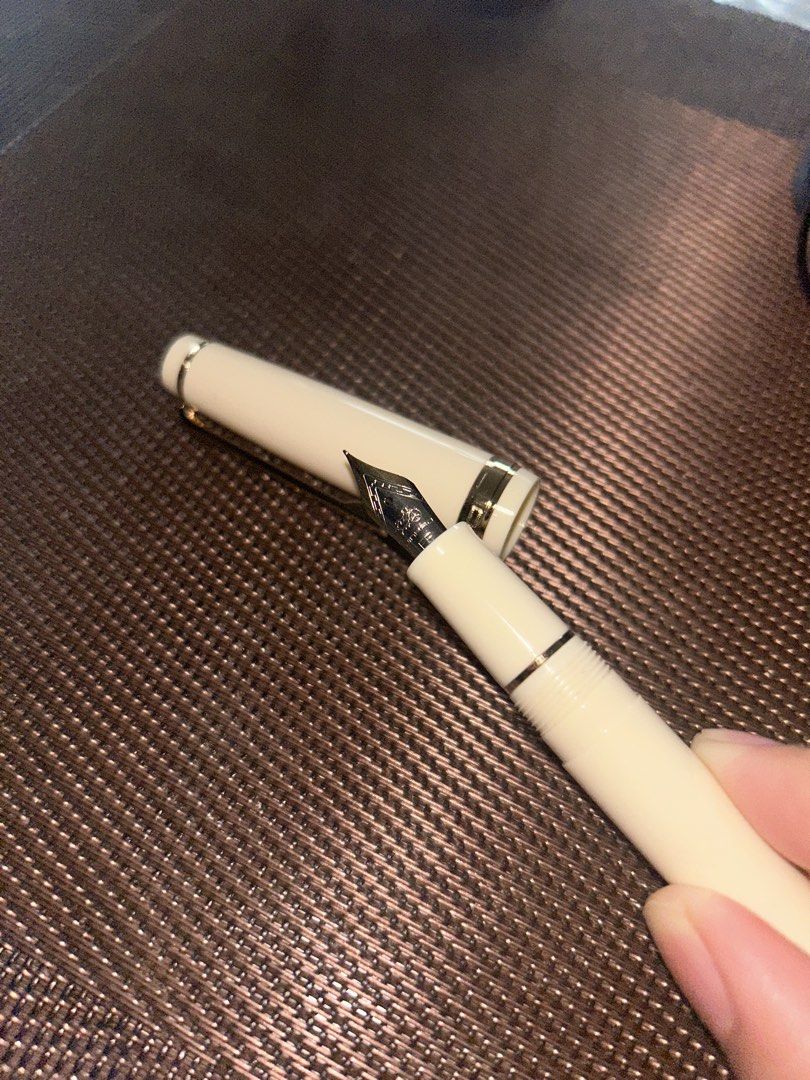 Jinhao 82 EF (Ivory White and Gold) (Category: Craft Supplies & Tools) located in Manila. Submitted by innansan (Listing ID 1457594557, Image 2). Description: Purchased on Tiktok Shop for 220 pesos Used once. Inked with Jinhao black ink. Price is negotiable, feel free to make offer. I will include some freebies :)). Shipping will be shouldered by the buyer..