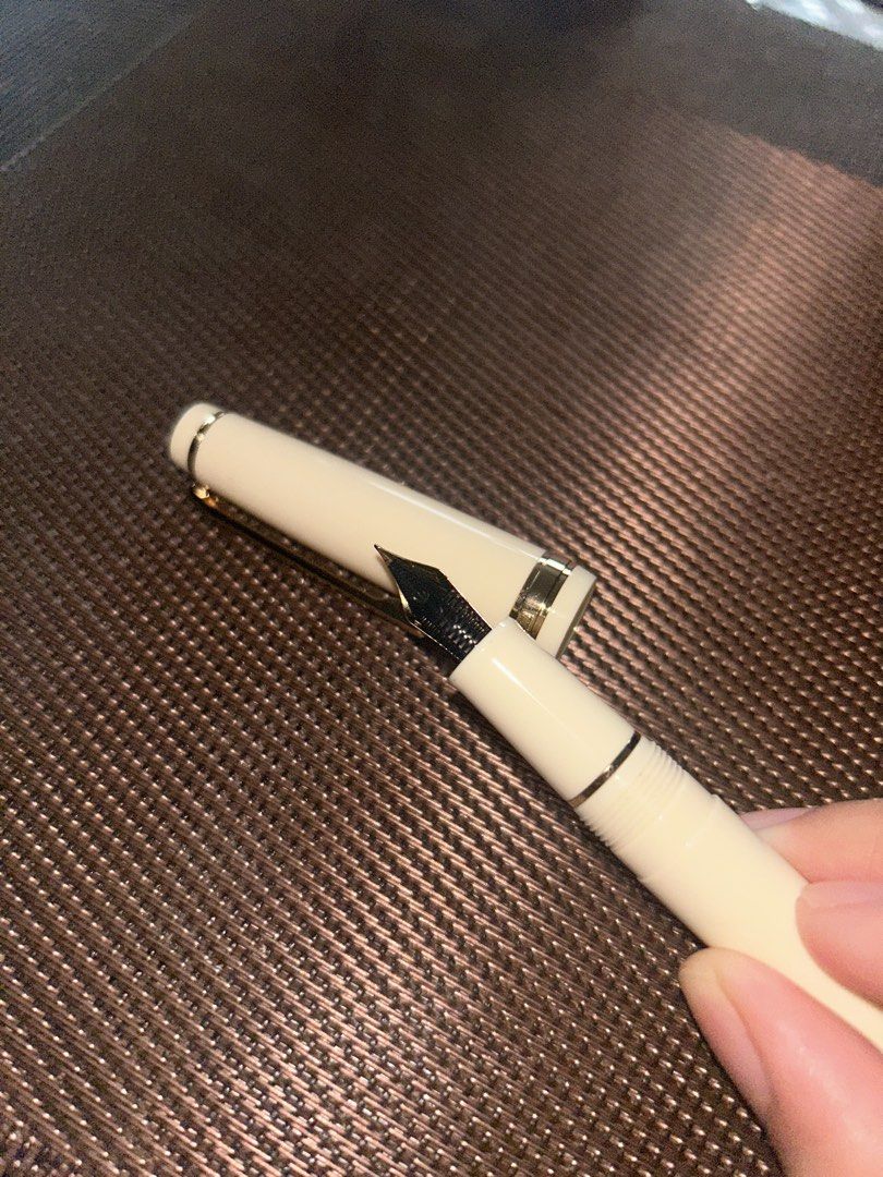 Jinhao 82 EF (Ivory White and Gold) (Category: Craft Supplies & Tools) located in Manila. Submitted by innansan (Listing ID 1457594557, Image 3). Description: Purchased on Tiktok Shop for 220 pesos Used once. Inked with Jinhao black ink. Price is negotiable, feel free to make offer. I will include some freebies :)). Shipping will be shouldered by the buyer..
