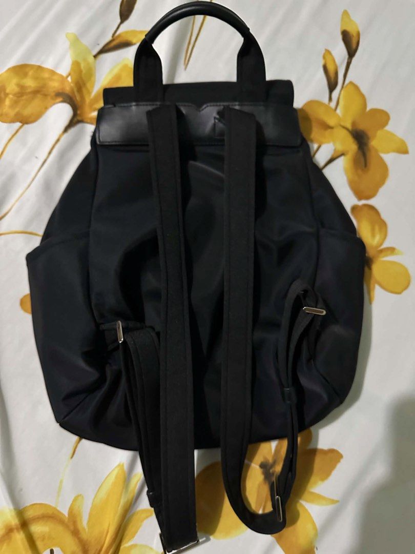 Kate Spade New York Carley Backpack Medium Nylon Black (Category: Backpacks) located in Quezon City. Submitted by hacked.233 (Listing ID 1457572483, Image 2). Description: - Brand: Kate Spade New York - Material: Black Nylon - Model: Carley - Size: Medium - Closure: Drawstring with flap top and magnetic snap - Features: Multiple front and side pockets for easy access - Straps: Adjustable shoulder straps - Ideal for: Everyday use or travel.
