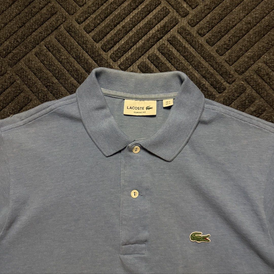 Lacoste Polo Shirt (powder blue) (Category: Tshirts & Polo Shirts ) located in Davao. Submitted by archived.status (Listing ID 1455456352, Image 3). Description: COLOR MAY VARY DUE TO LIGHTING‼️ Condition: 9.5/10 Color rate: 9.5/10 Issue: cut washtag Size Medium fit Large Width 21 Length 27.