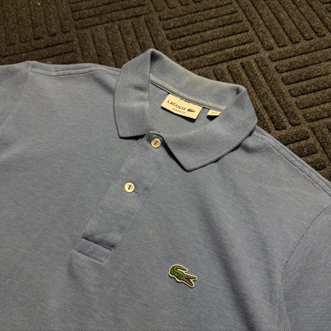 Lacoste Polo Shirt (powder blue) (Category: Tshirts & Polo Shirts ) located in Davao. Submitted by archived.status (Listing ID 1455456352, Image 2). Description: COLOR MAY VARY DUE TO LIGHTING‼️ Condition: 9.5/10 Color rate: 9.5/10 Issue: cut washtag Size Medium fit Large Width 21 Length 27.
