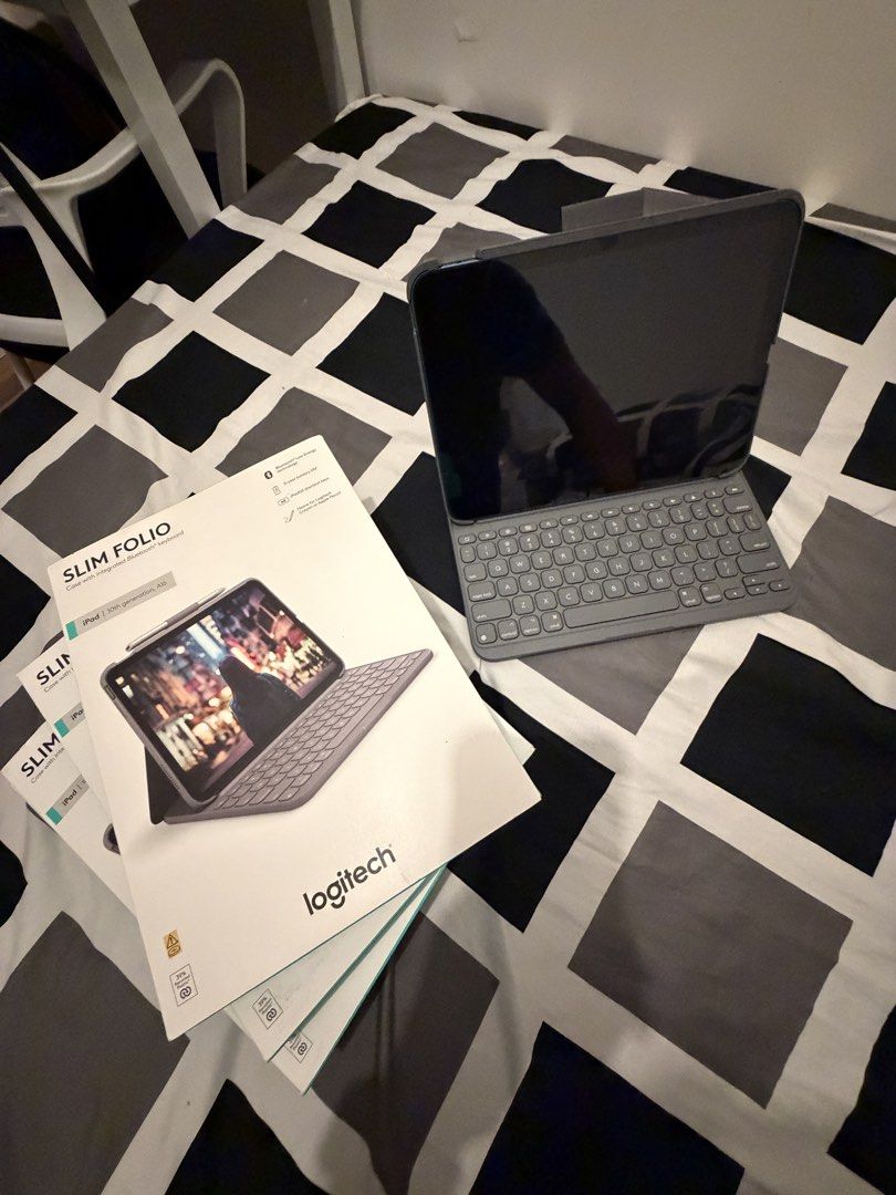 Logitech Slim Folio Keyboard Case for iPad 11" (10th-11th Gen) (Category: Cases & Sleeves) located in Quezon City. Submitted by edisonjenner (Listing ID 1457559599, Image 2). Description: - Logitech Slim Folio Keyboard Case - Compatible with iPad 11-inch (10th & 11th Generation) - Color: Oxford Grey - Secure magnetic closure - Integrated Apple Pencil holder - Provides protection for your iPad - Offers a comfortable typing experience - Original bo