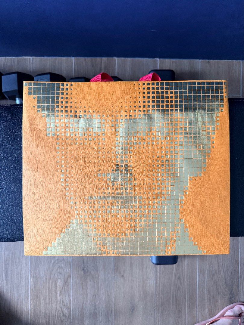 Louis Vuitton Shopping Bag (Category: Luxury Bags & Wallets) located in Marikina City. Submitted by teacher.maria (Listing ID 1457525616, Image 1). Description: This is a limited-edition Louis Vuitton 200th birthday shopping bag featuring a metallic gold pixelated portrait of founder Louis Vuitton.