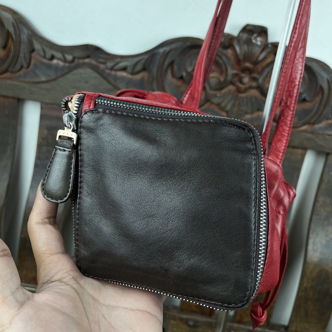 MARNI Tri-Color Convertible Zip-Bottom Handbag (Category: Luxury Bags & Wallets) located in Quezon City. Submitted by forgarments (Listing ID 1457623379, Image 3). Description: MARNI Tri-Color Convertible Zip-Bottom Handbag Excellent Condition - Stains Width: 9.5 Inches Height: 7.5-12 Inches Depth: 5x5 Inches (bucket bottom) Handle drop: 10 Inches Crafted in Italy from supple, fine-grain leather, this Marni handbag exemplifies the house’s penchan