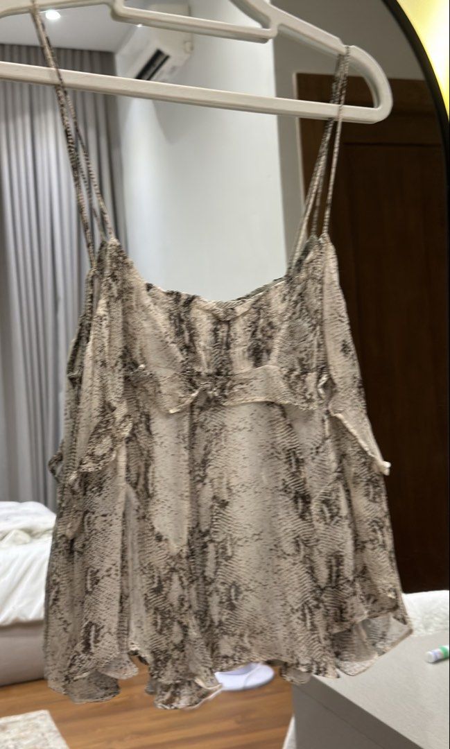 Massimo Dutti Sheer Snake Print Ruffle Camisole Top (Category: Sleeveless) located in Meycauayan. Submitted by m4teri4lgirl (Listing ID 1457612415, Image 2). Description: WORN ONCE OG PRICE ₱4490 -Cute sheer camisole top - Trendy snake print - Ruffle details on front and sides - Adjustable spaghetti straps - Versatile: pairs well with shorts or jeans - Perfect for night outs or casual days.