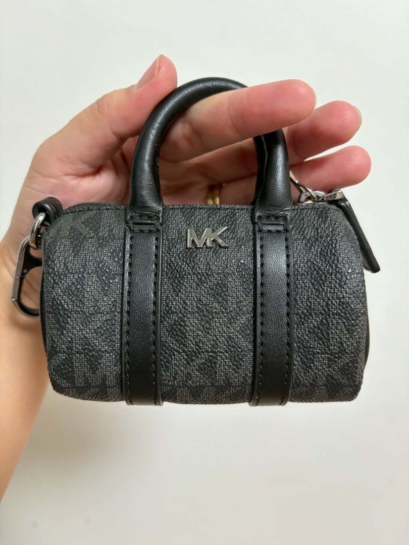 Michael Kors MK Micro Duffle Key Fob Black (Category: Luxury Bags & Wallets) located in Cavite. Submitted by genshop2019 (Listing ID 1457687241, Image 2). Description: - Authentic Michael Kors micro duffle key fob - Includes a keychain clip for easy attachment - Comes with its original box - Ideal for personalizing your bag or keys.