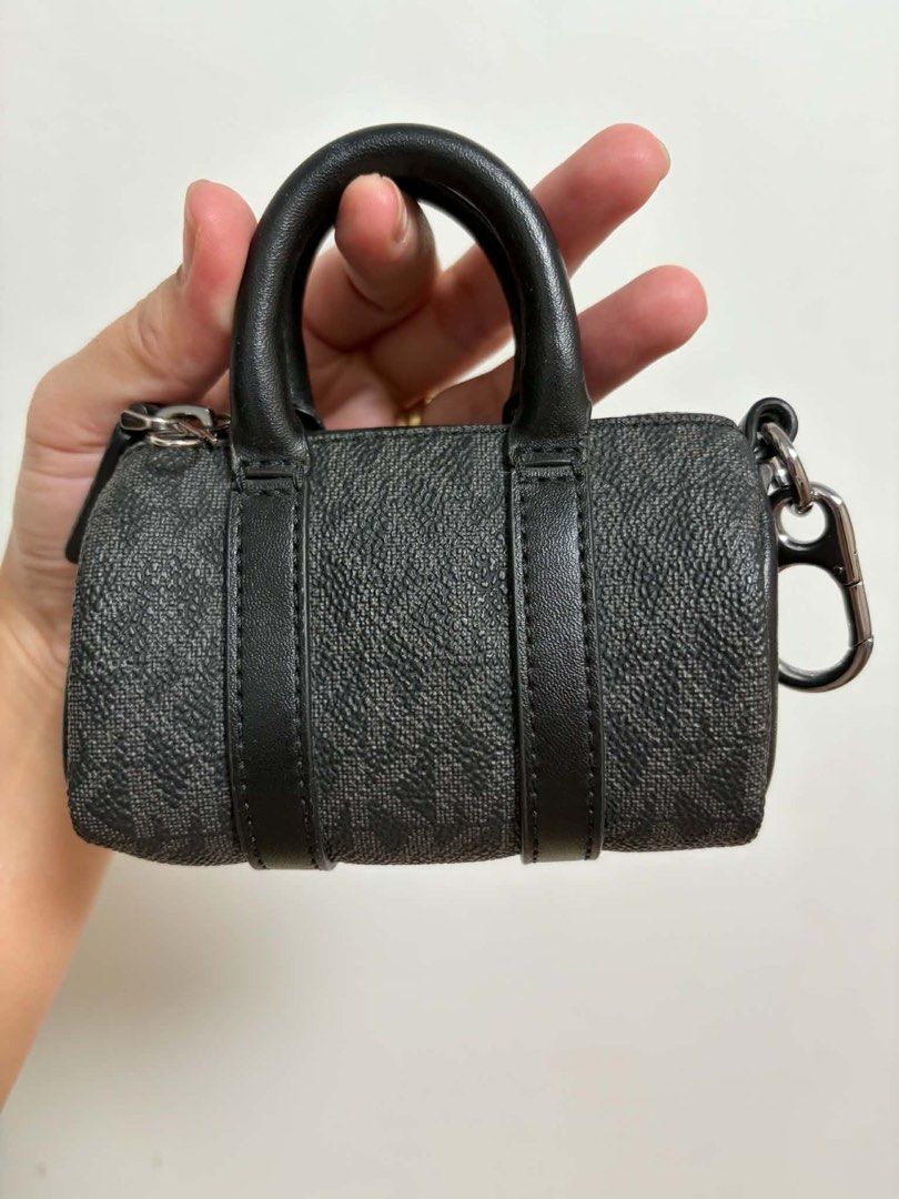 Michael Kors MK Micro Duffle Key Fob Black (Category: Luxury Bags & Wallets) located in Cavite. Submitted by genshop2019 (Listing ID 1457687241, Image 3). Description: - Authentic Michael Kors micro duffle key fob - Includes a keychain clip for easy attachment - Comes with its original box - Ideal for personalizing your bag or keys.