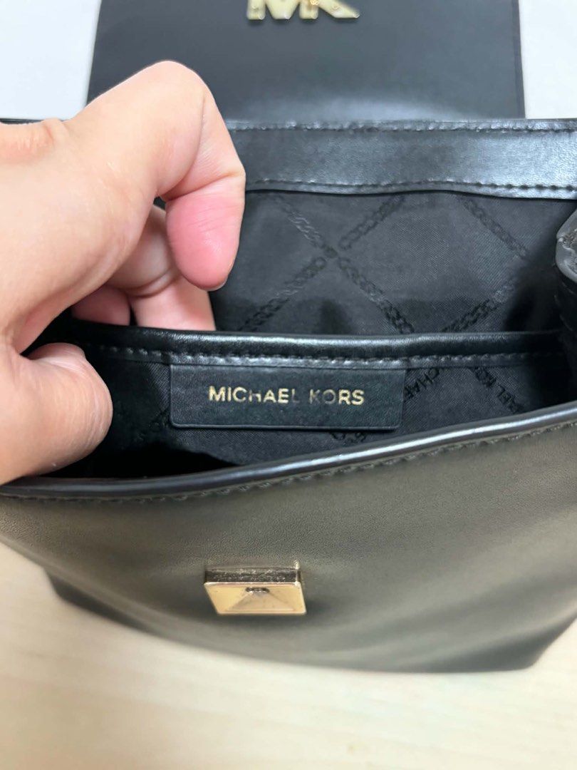 Michael Kors Mott Black Leather Backpack (Category: Backpacks) located in Cavite. Submitted by genshop2019 (Listing ID 1457687105, Image 3). Description: - Authentic Michael Kors Mott Backpack - Color: Black - Material: Genuine Leather - Hardware: Gold-tone - Stylish chain strap, main compartment, interior pocket -with original tags and care card - Ideal for: Everyday wear, stylish and practical.