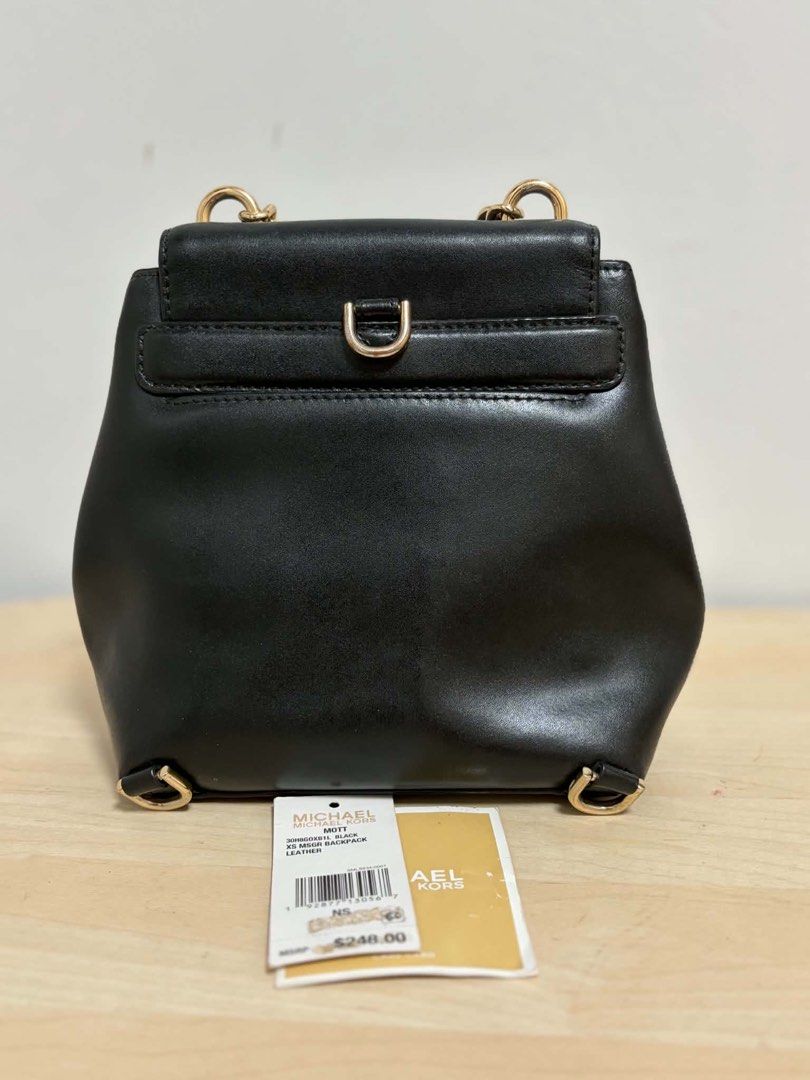 Michael Kors Mott Black Leather Backpack (Category: Backpacks) located in Cavite. Submitted by genshop2019 (Listing ID 1457687105, Image 2). Description: - Authentic Michael Kors Mott Backpack - Color: Black - Material: Genuine Leather - Hardware: Gold-tone - Stylish chain strap, main compartment, interior pocket -with original tags and care card - Ideal for: Everyday wear, stylish and practical.