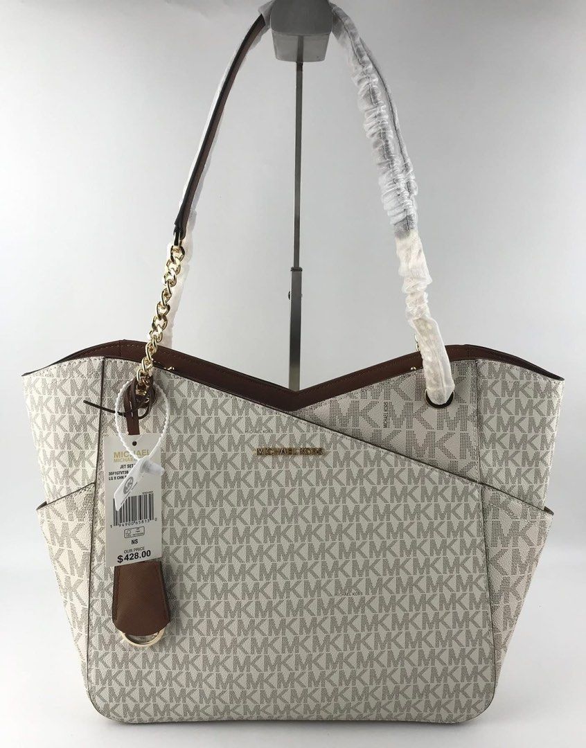 MK Jetset Travel Tote Bag (Category: Tote Bags) located in Manila. Submitted by msddirectfactoryoutlet (Listing ID 1457644287, Image 2). Description: MK Jetset Travel Tote 15.6”W X 11”H X 5.5”D US Grade 100%.