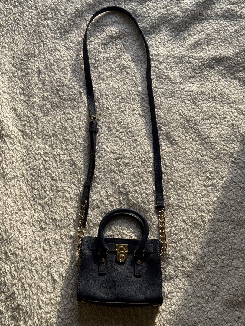 MK mini sling bag (Category: Luxury Bags & Wallets) located in Cebu City. Submitted by farahjeani55804 (Listing ID 1457707973, Image 2). Description: Original to MK mini. Sa mga hilig cute baga yan selling this. Still in great condition. Di kasya phone!!! Cebu City loc. Rush sale.