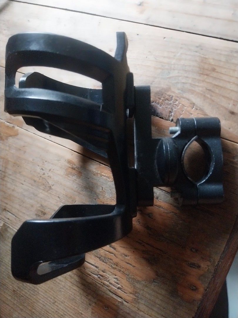 Motowolf Bottle Holder (Category: Bicycles) located in Paranaque City. Submitted by riccsmars (Listing ID 1457517811, Image 2). Description: Adjustable black bike cup holder. Mounts on handlebars/frame. Securely holds drinks. Easy install. Perfect for water or coffee on rides. .