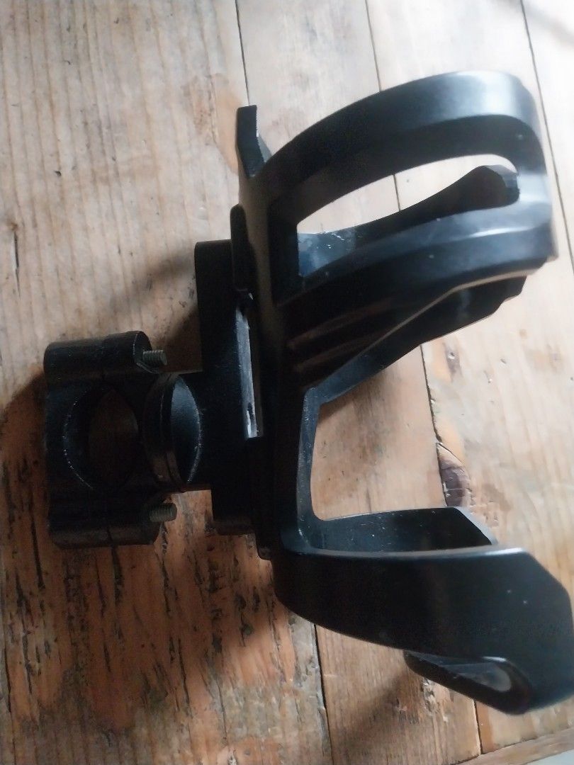 Motowolf Bottle Holder (Category: Bicycles) located in Paranaque City. Submitted by riccsmars (Listing ID 1457517811, Image 1). Description: Adjustable black bike cup holder. Mounts on handlebars/frame. Securely holds drinks. Easy install. Perfect for water or coffee on rides. .